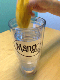 Mango Dunked in Cup of Water Gif