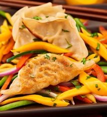 Pork Pot Stickers with Red Pepper Jam & Pickled Mango Slaw