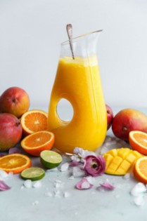 Summer mango recipes - Pitcher of mango citrus fruit punch and fruits for summer