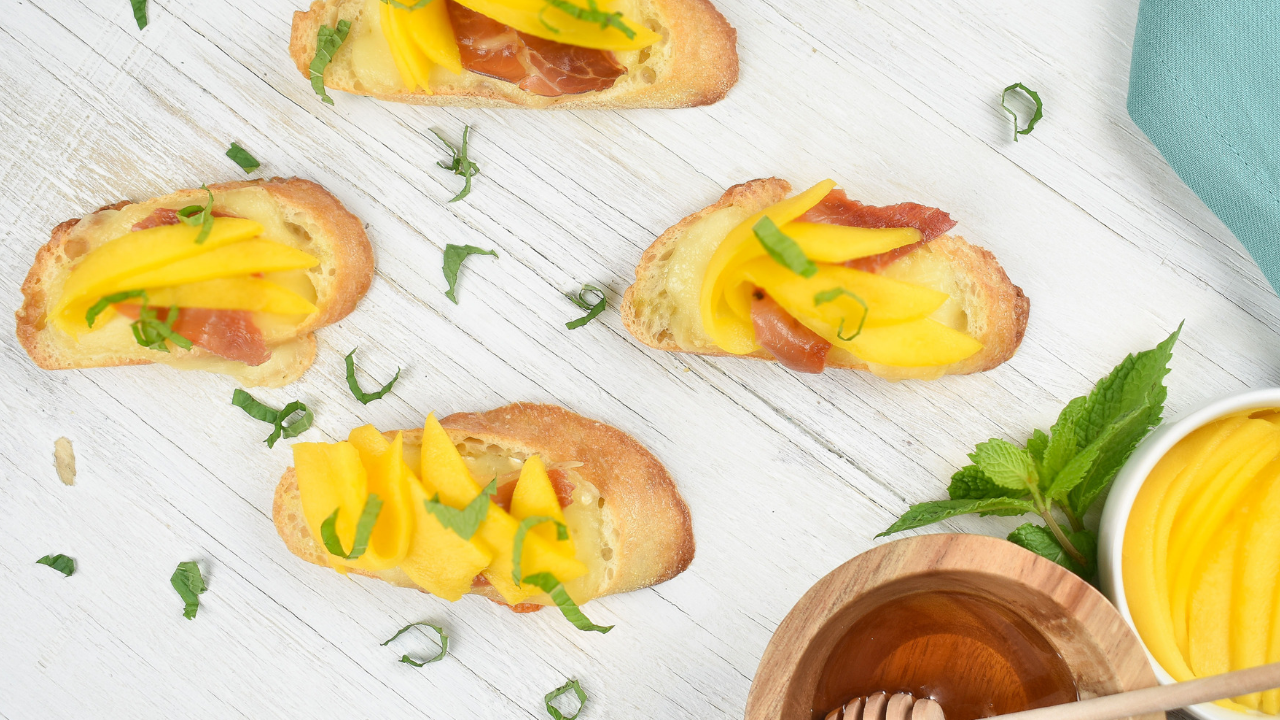 Ayesha Curry Holiday Recipe - mango crostini with crispy prosciutto and brie