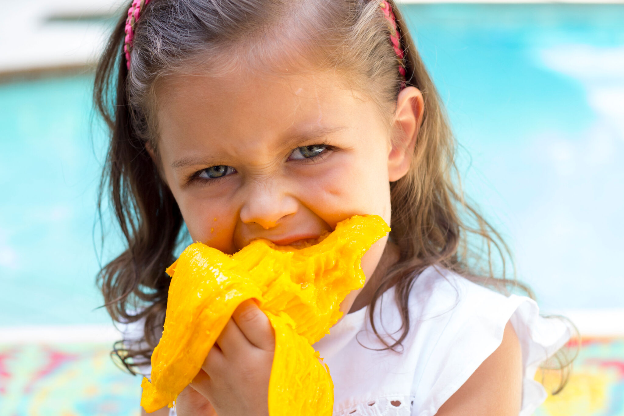 Girl enjoying Mango Snack